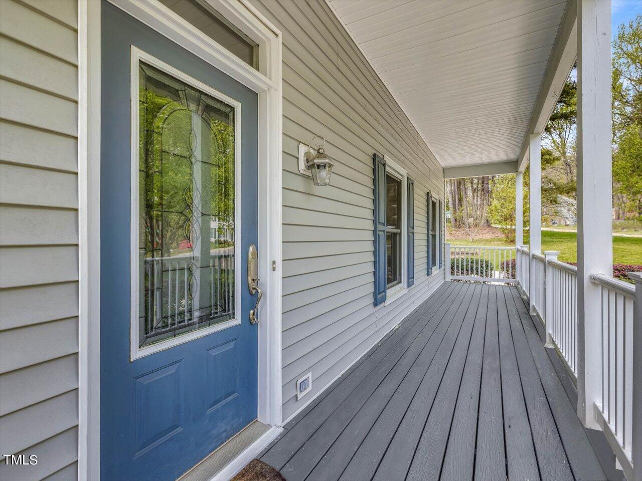 7001 Three Bridges Circle Raleigh, NC 27613 - Photo 2 of 25 a view of a house with porch and wooden floor