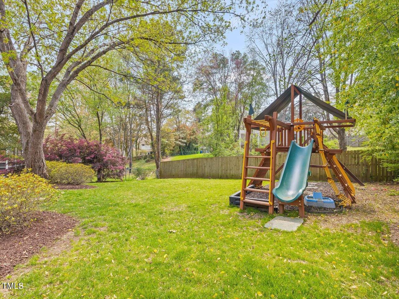 7001 Three Bridges Circle Raleigh, NC 27613 - Photo 21 of 25 a view of a park with a slide