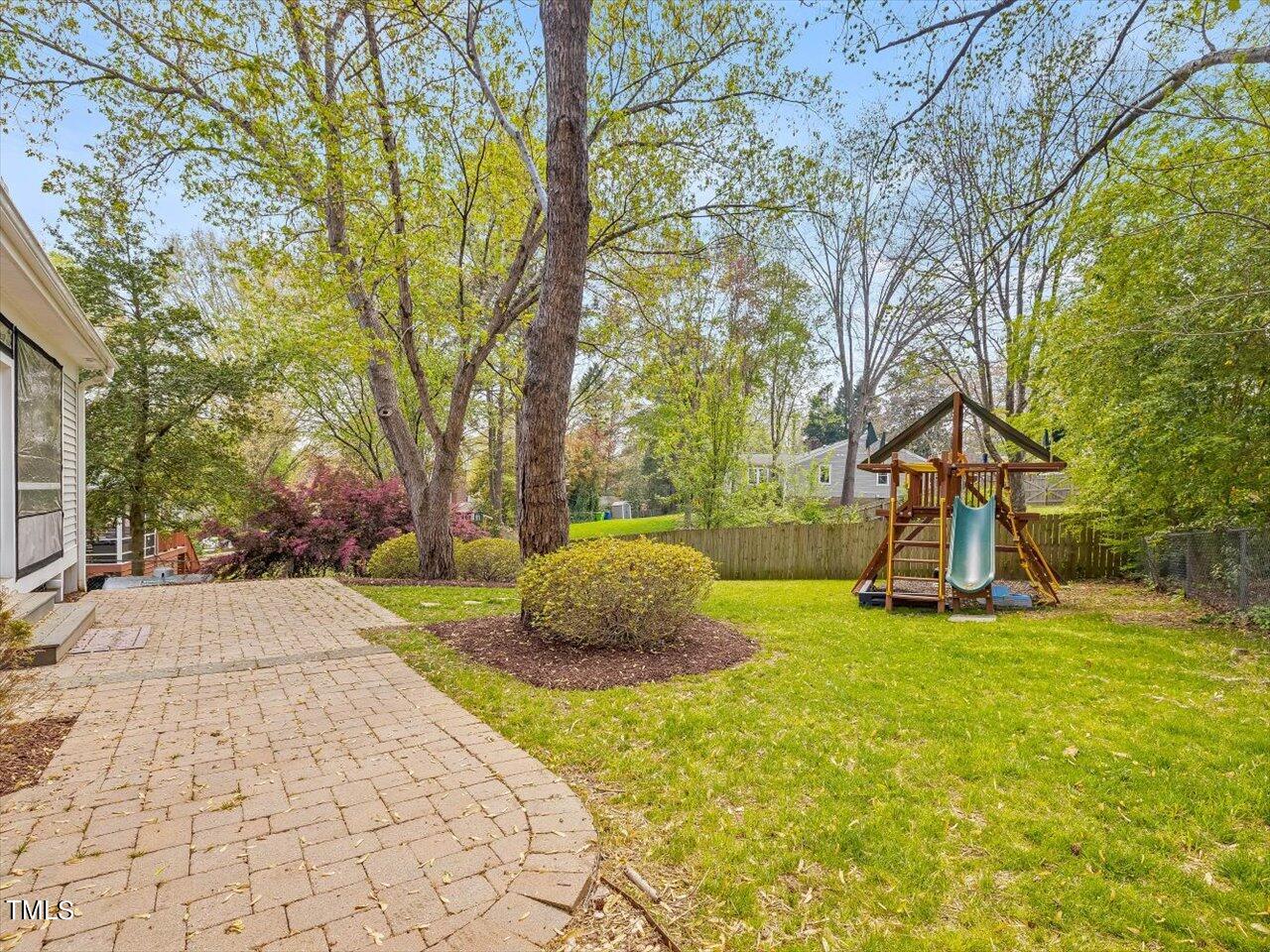 7001 Three Bridges Circle Raleigh, NC 27613 - Photo 22 of 25 a house view with a garden