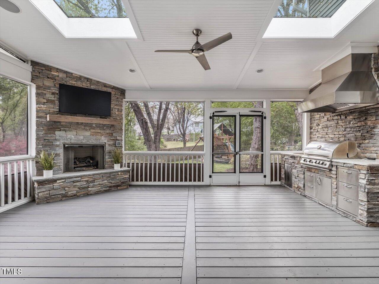 7001 Three Bridges Circle Raleigh, NC 27613 - Photo 8 of 25 a view of an empty room with a fireplace and a window