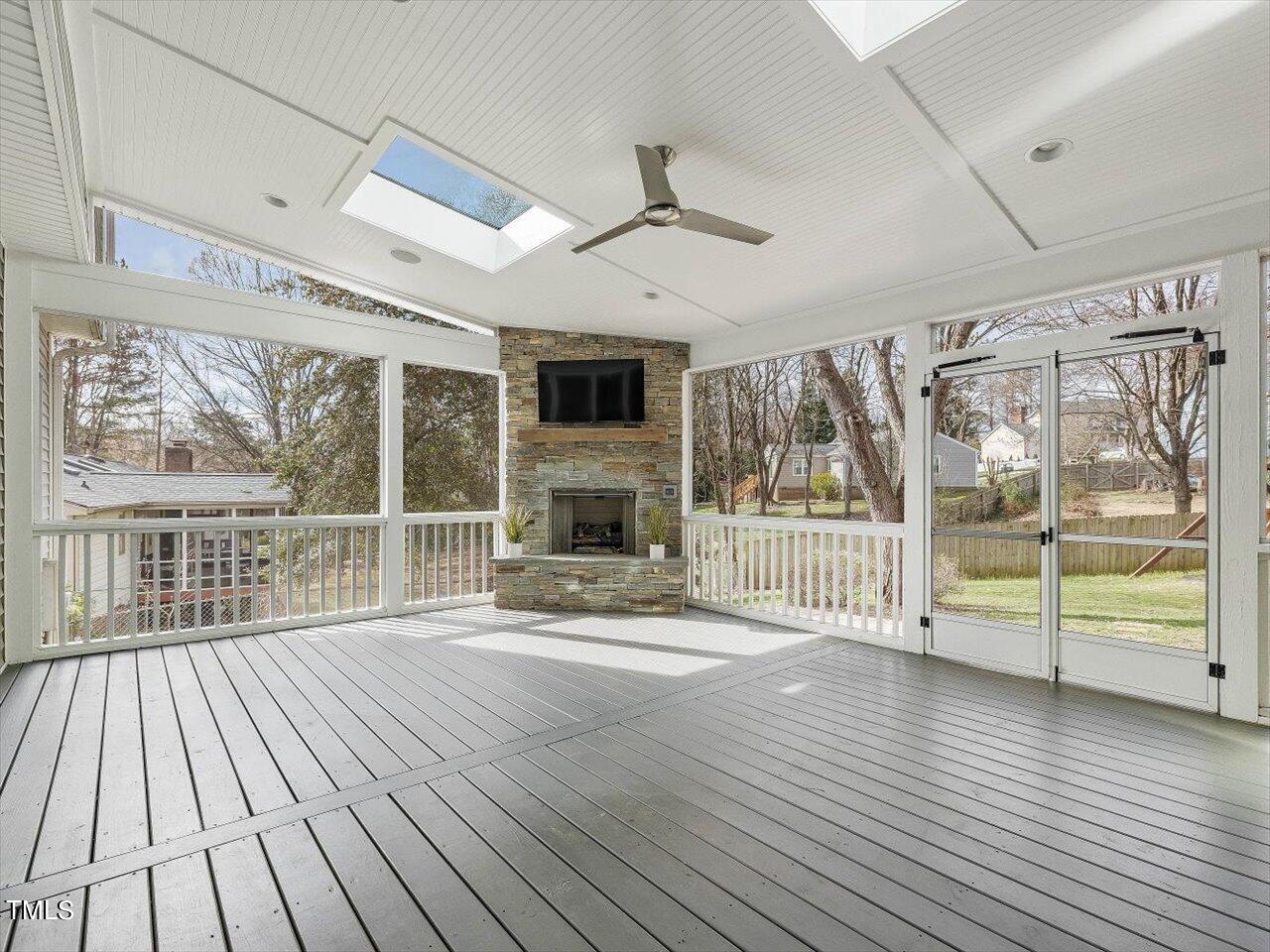 7001 Three Bridges Circle Raleigh, NC 27613 - Photo 9 of 25 a view of livingroom with furniture wooden floor window and a fire place