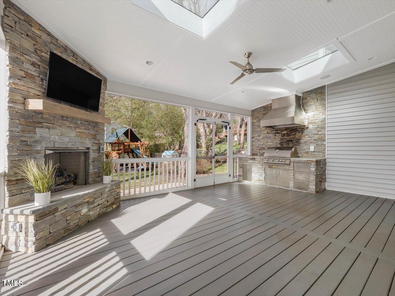 7001 Three Bridges Circle Raleigh, NC 27613 - Photo 10 of 25 a view of a livingroom with wooden floor and a fireplace