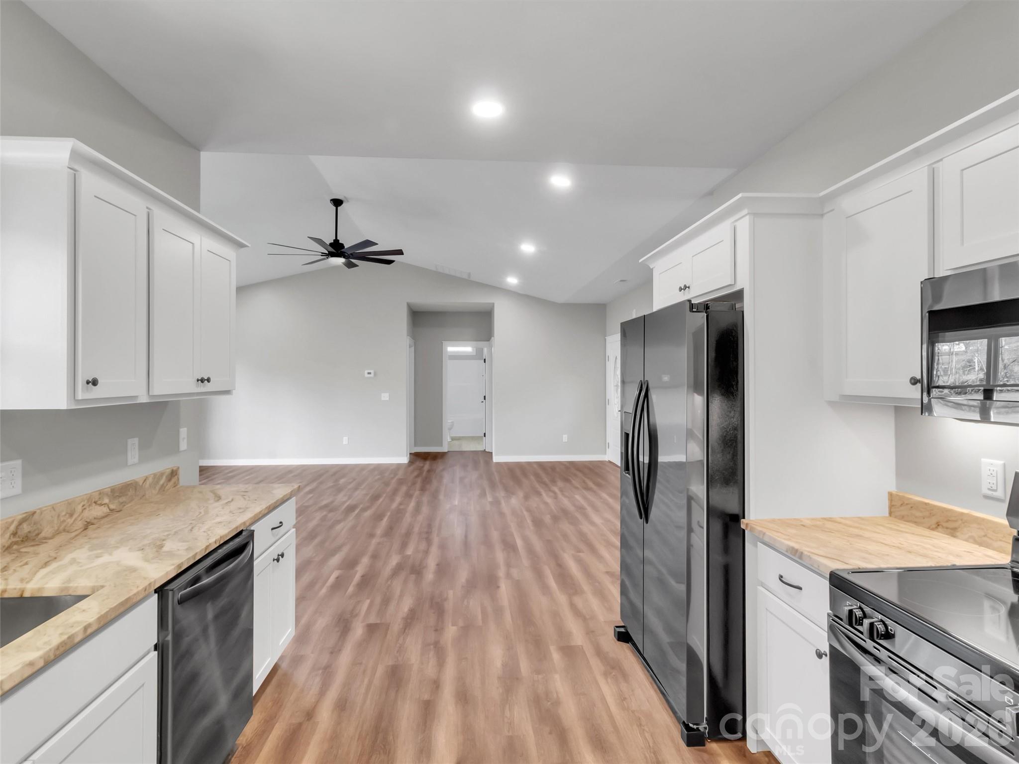171 Peyton Elaine Road Clyde, NC 28721 - Photo 12 of 25 a kitchen with a refrigerator and a sink