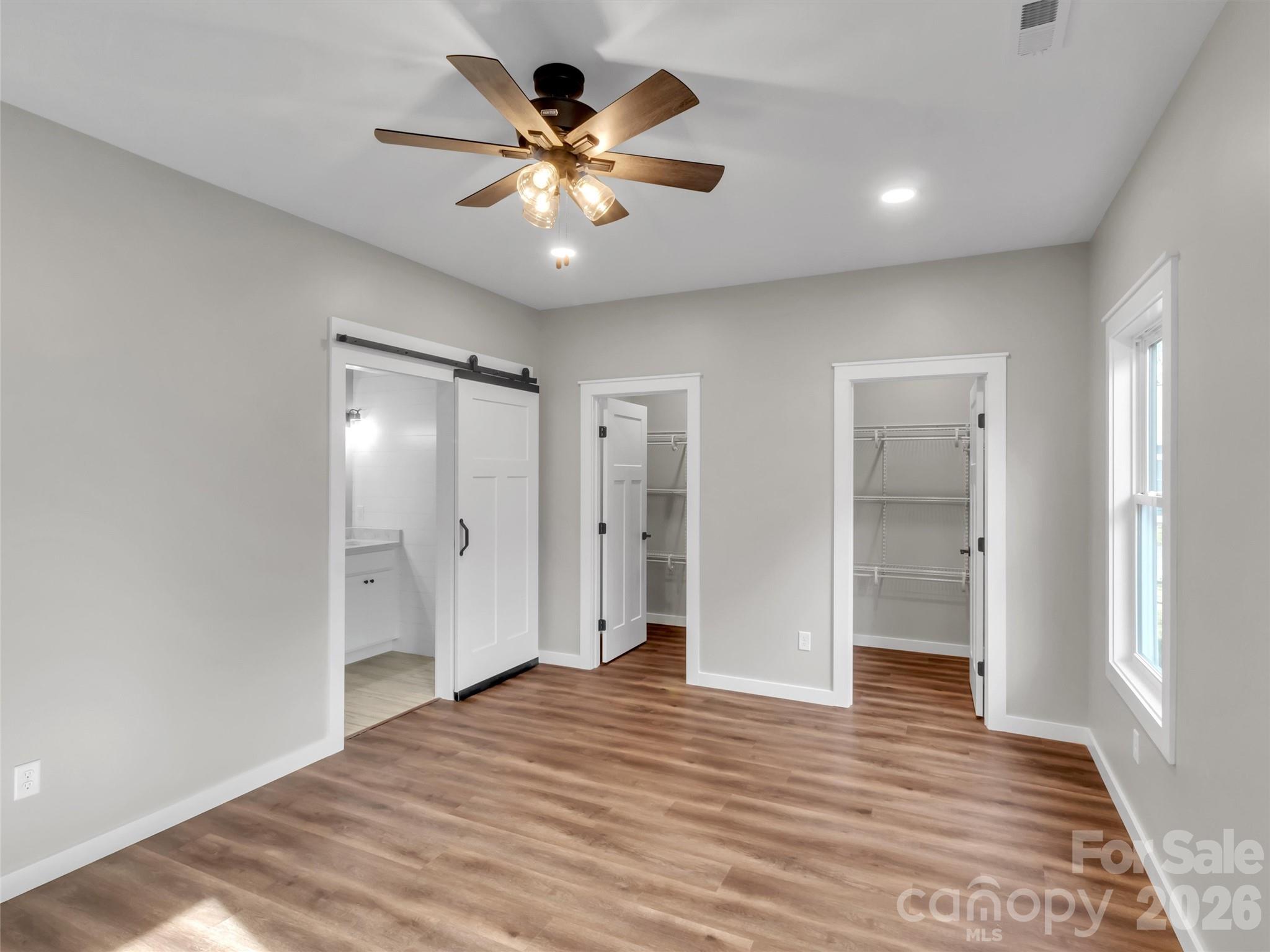 171 Peyton Elaine Road Clyde, NC 28721 - Photo 13 of 25 a view of an empty room and wooden floor