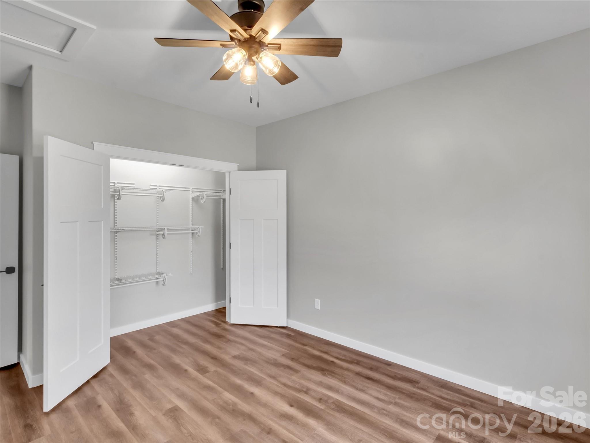 171 Peyton Elaine Road Clyde, NC 28721 - Photo 18 of 25 wooden floor in an empty room