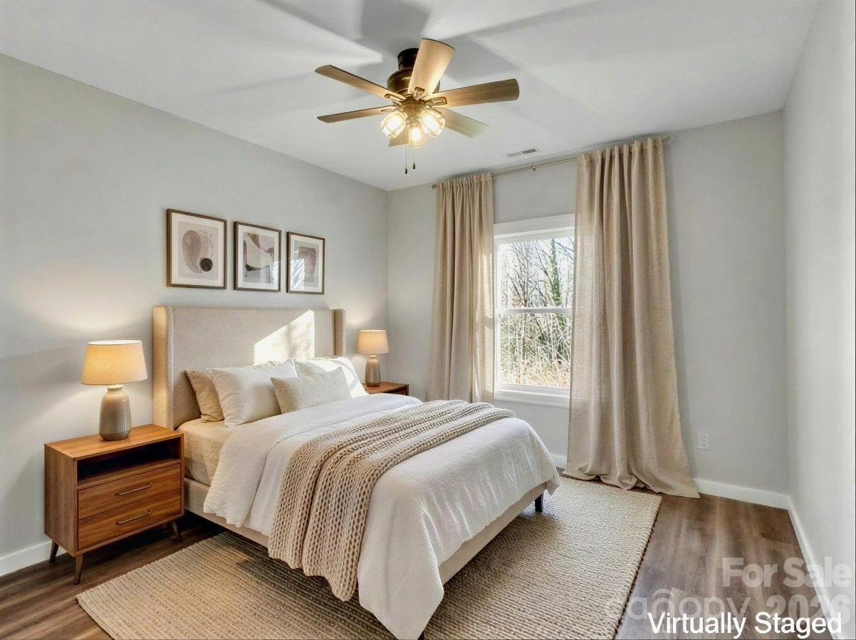 171 Peyton Elaine Road Clyde, NC 28721 - Photo 19 of 25 a bedroom with a large bed and a window