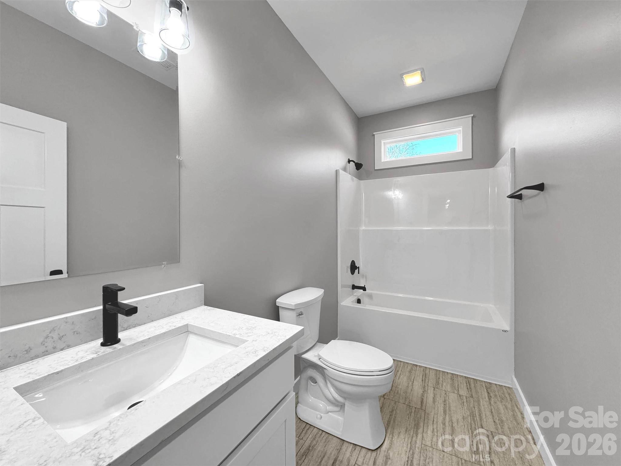171 Peyton Elaine Road Clyde, NC 28721 - Photo 20 of 25 a bathroom with a sink a toilet and shower