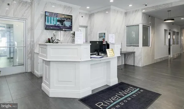 a kitchen with kitchen island a sink stainless steel appliances and cabinets