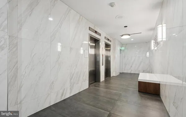 a bathroom with a double vanity sink and mirror