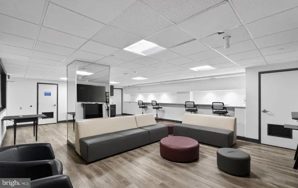 a large living room with furniture and a couch