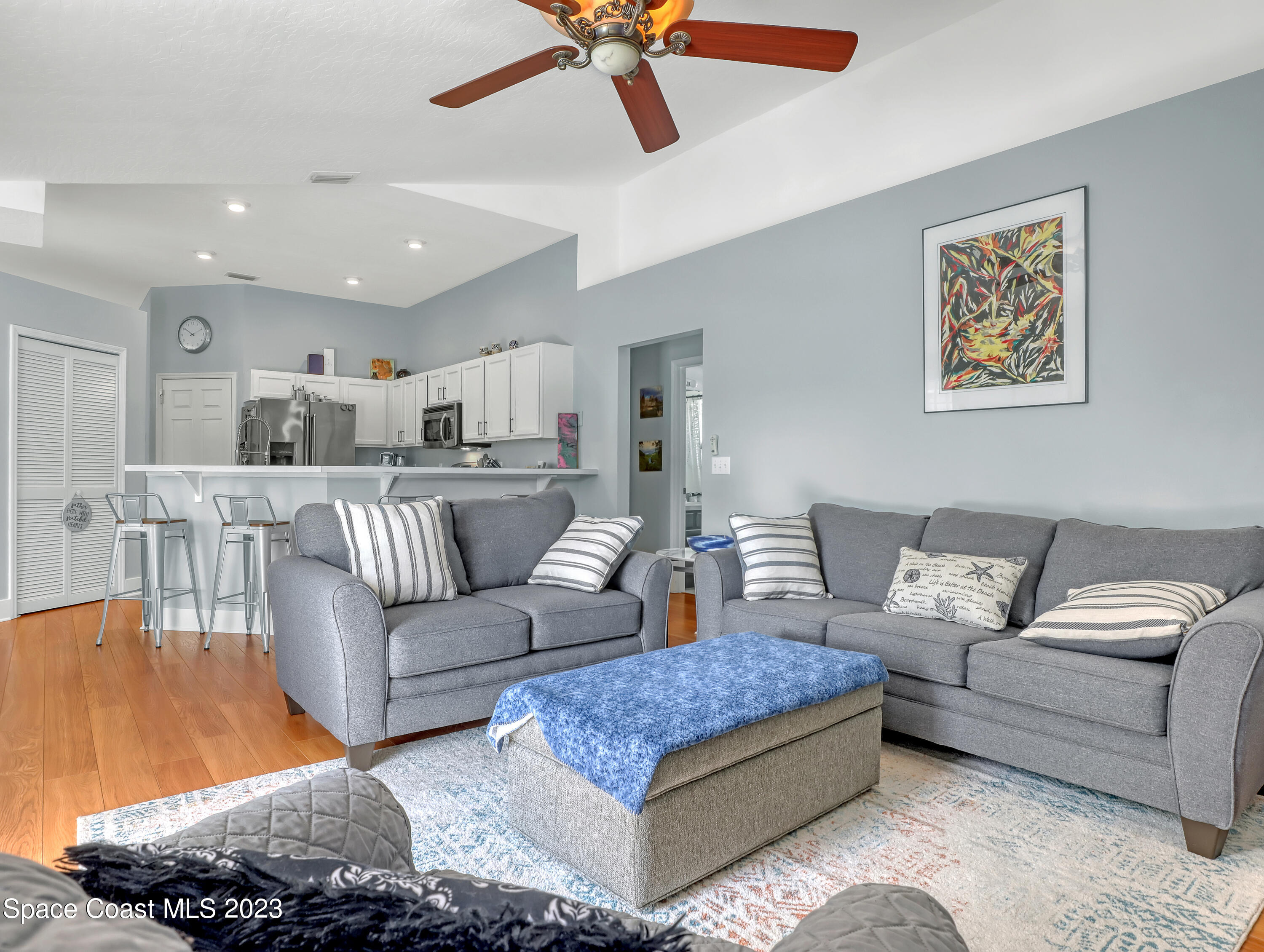 1025 Oak Tree Place Malabar, FL 32950 - Photo 11 of 33 a living room with furniture and a view of kitchen