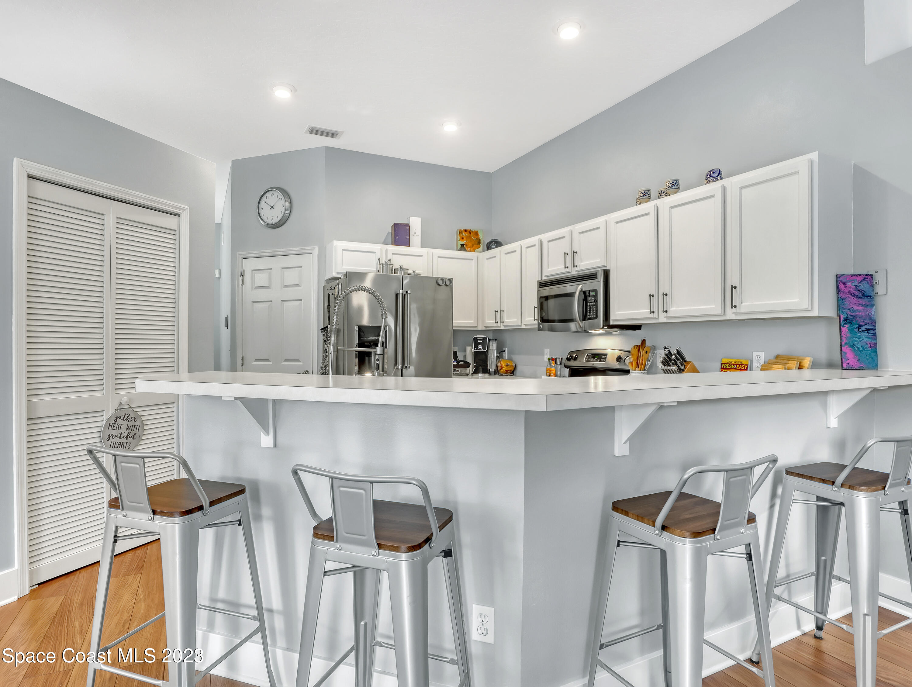1025 Oak Tree Place Malabar, FL 32950 - Photo 13 of 33 a kitchen with a sink cabinets and window