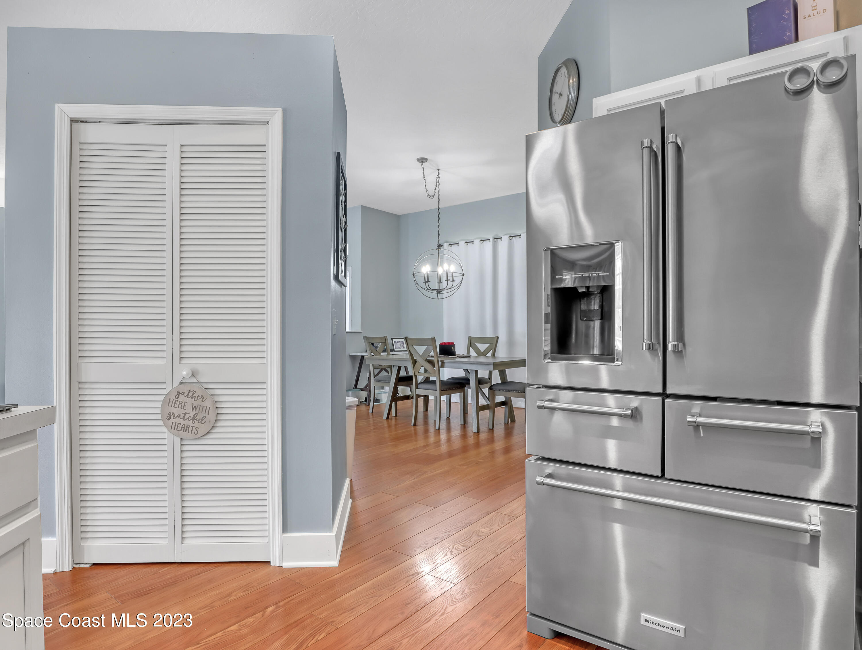 1025 Oak Tree Place Malabar, FL 32950 - Photo 16 of 33 a kitchen with stainless steel appliances refrigerator and microwave