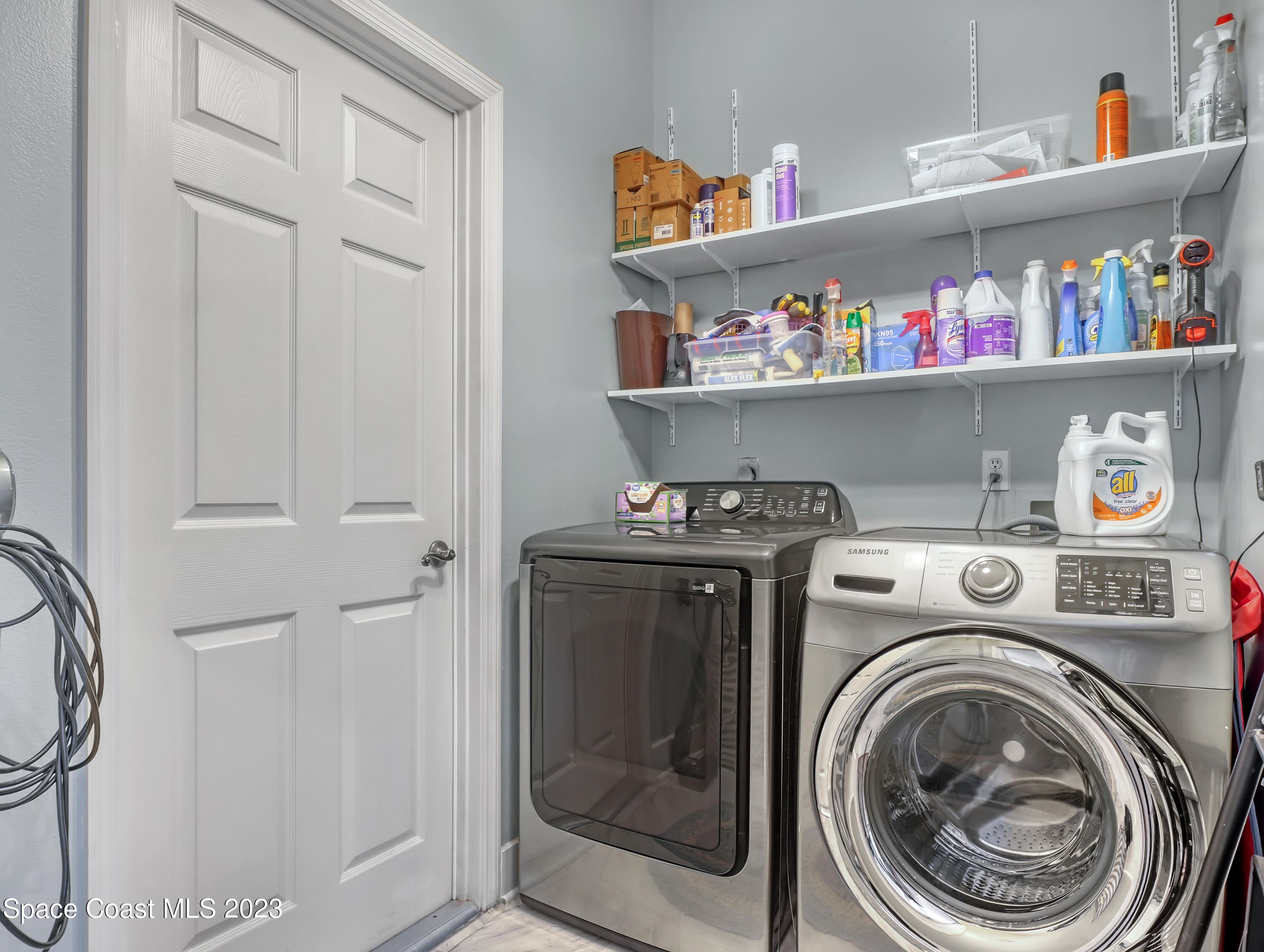 1025 Oak Tree Place Malabar, FL 32950 - Photo 19 of 33 a utility room with dryer and washer