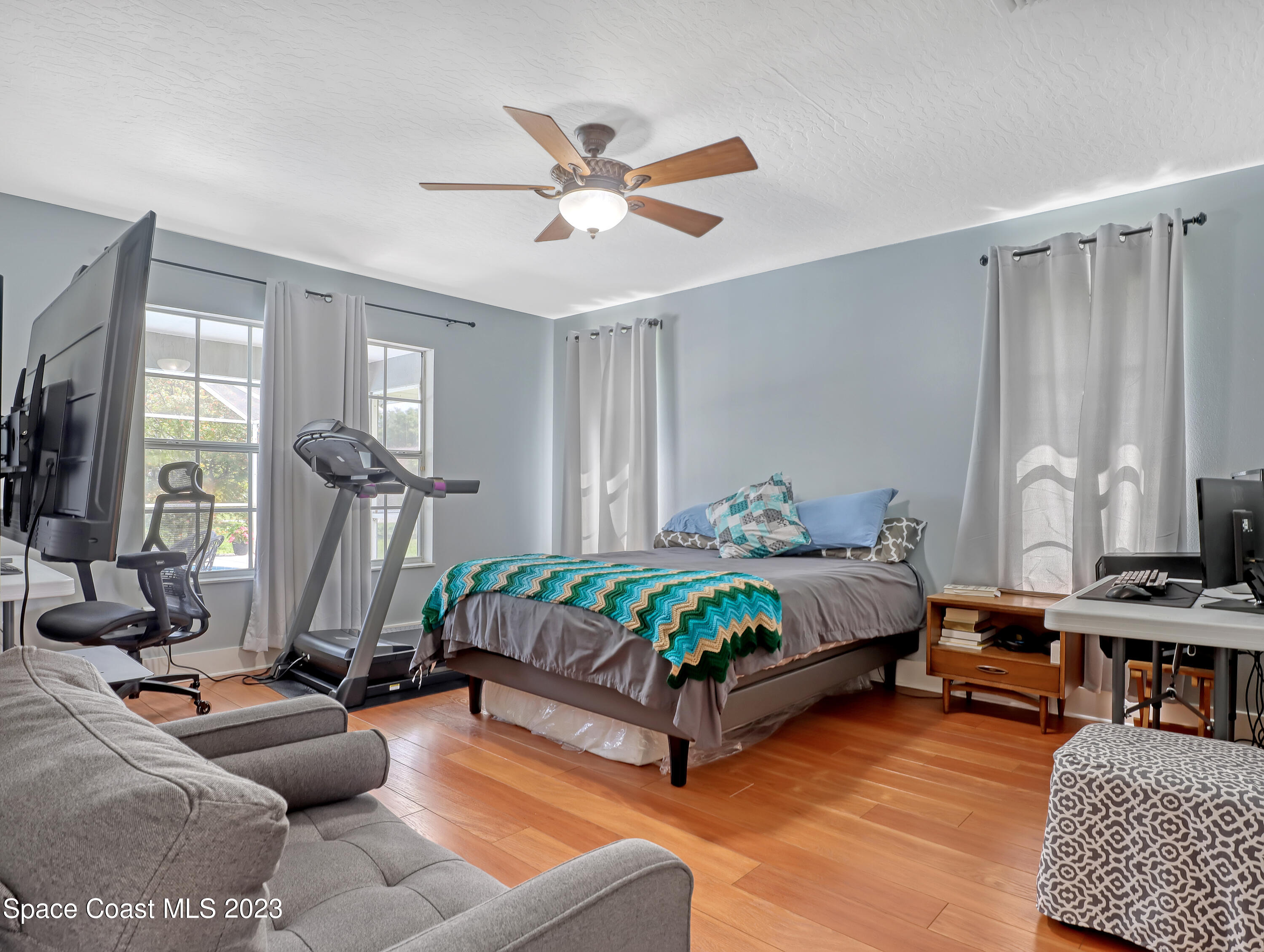 1025 Oak Tree Place Malabar, FL 32950 - Photo 20 of 33 a bedroom with furniture and a window