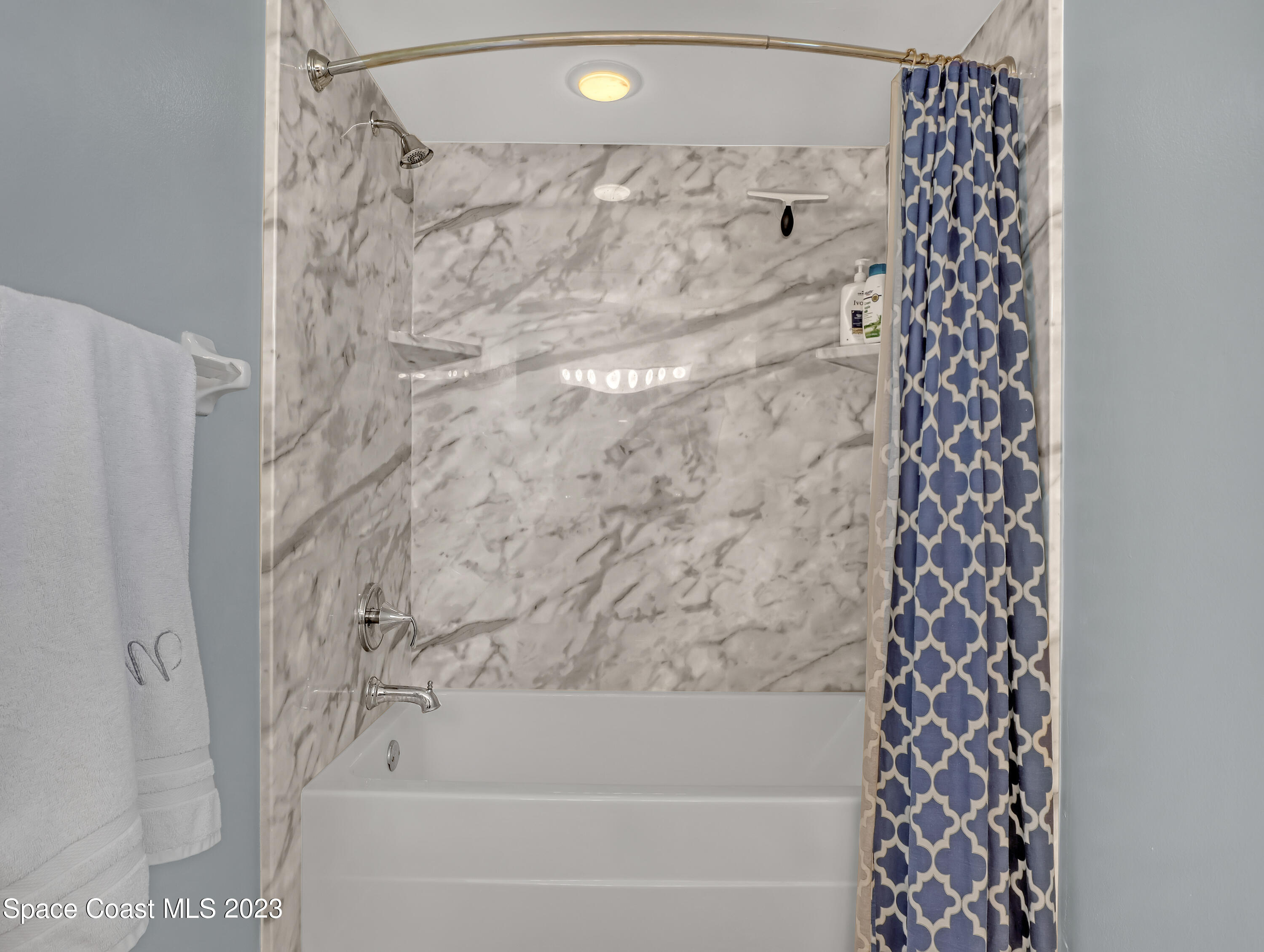 1025 Oak Tree Place Malabar, FL 32950 - Photo 23 of 33 a bathroom with a bathtub and shower