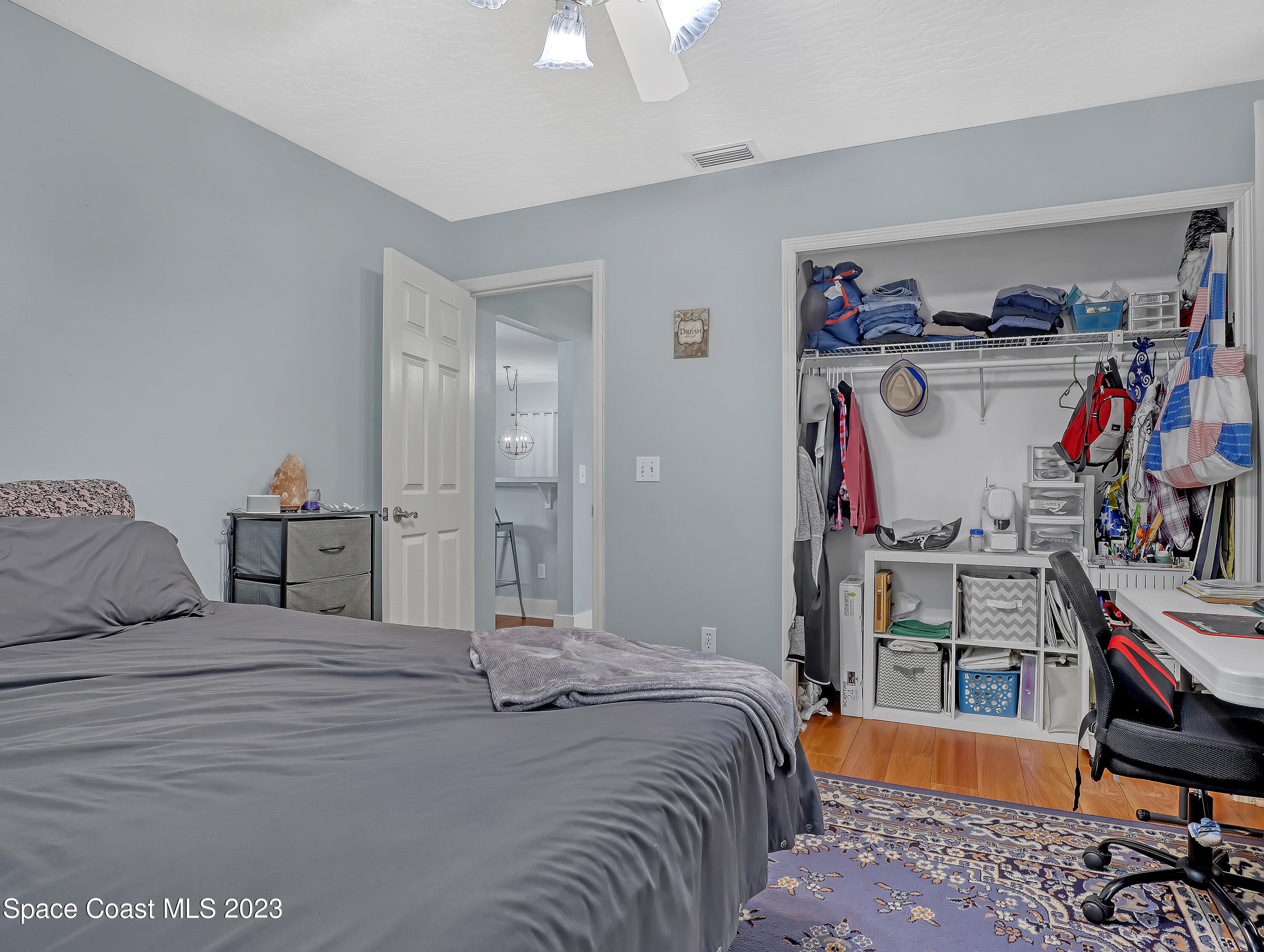 1025 Oak Tree Place Malabar, FL 32950 - Photo 25 of 33 a bedroom with a bed and a desk