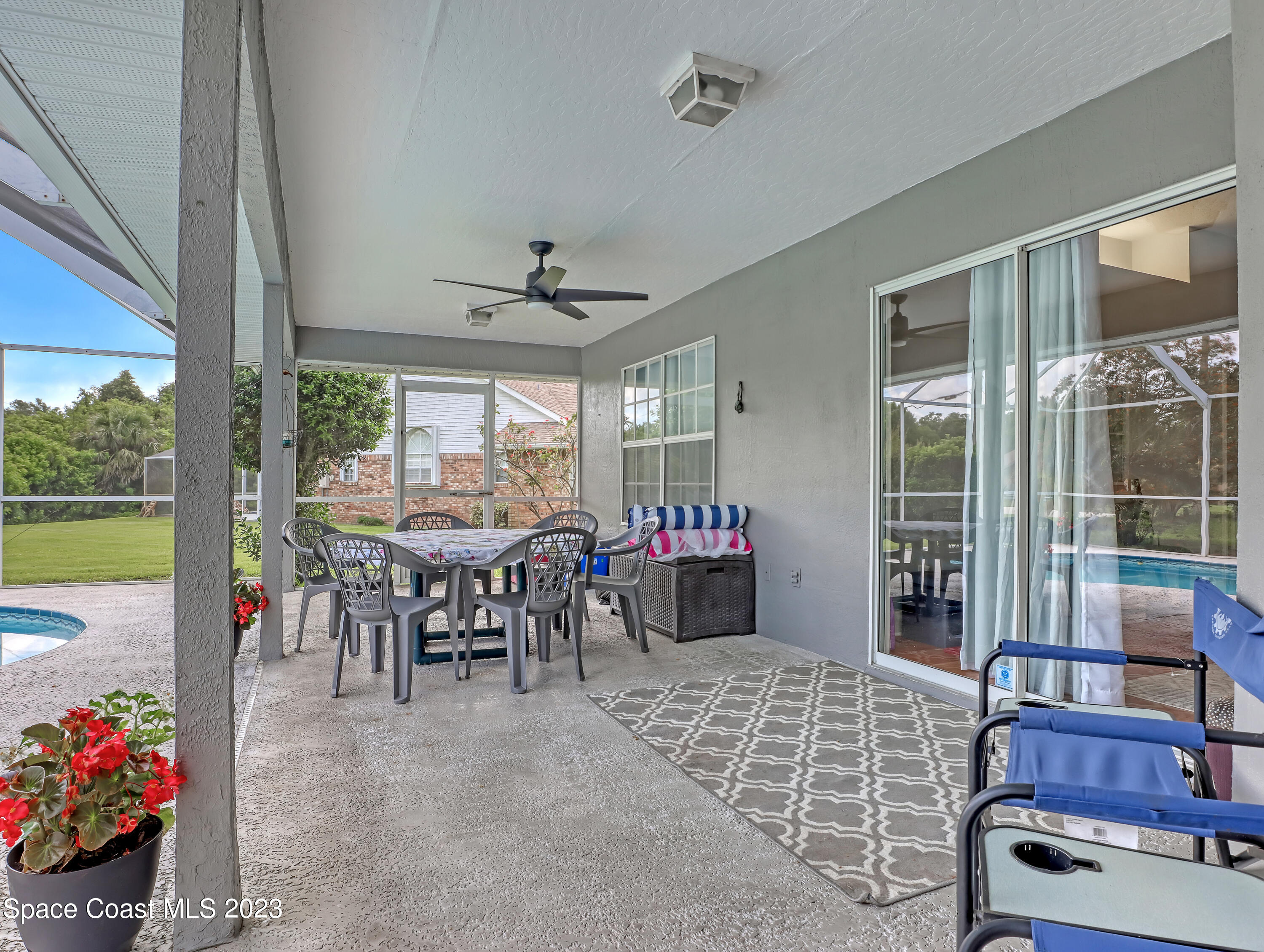 1025 Oak Tree Place Malabar, FL 32950 - Photo 28 of 33 a view of a dining room with furniture window and a floor to ceiling window