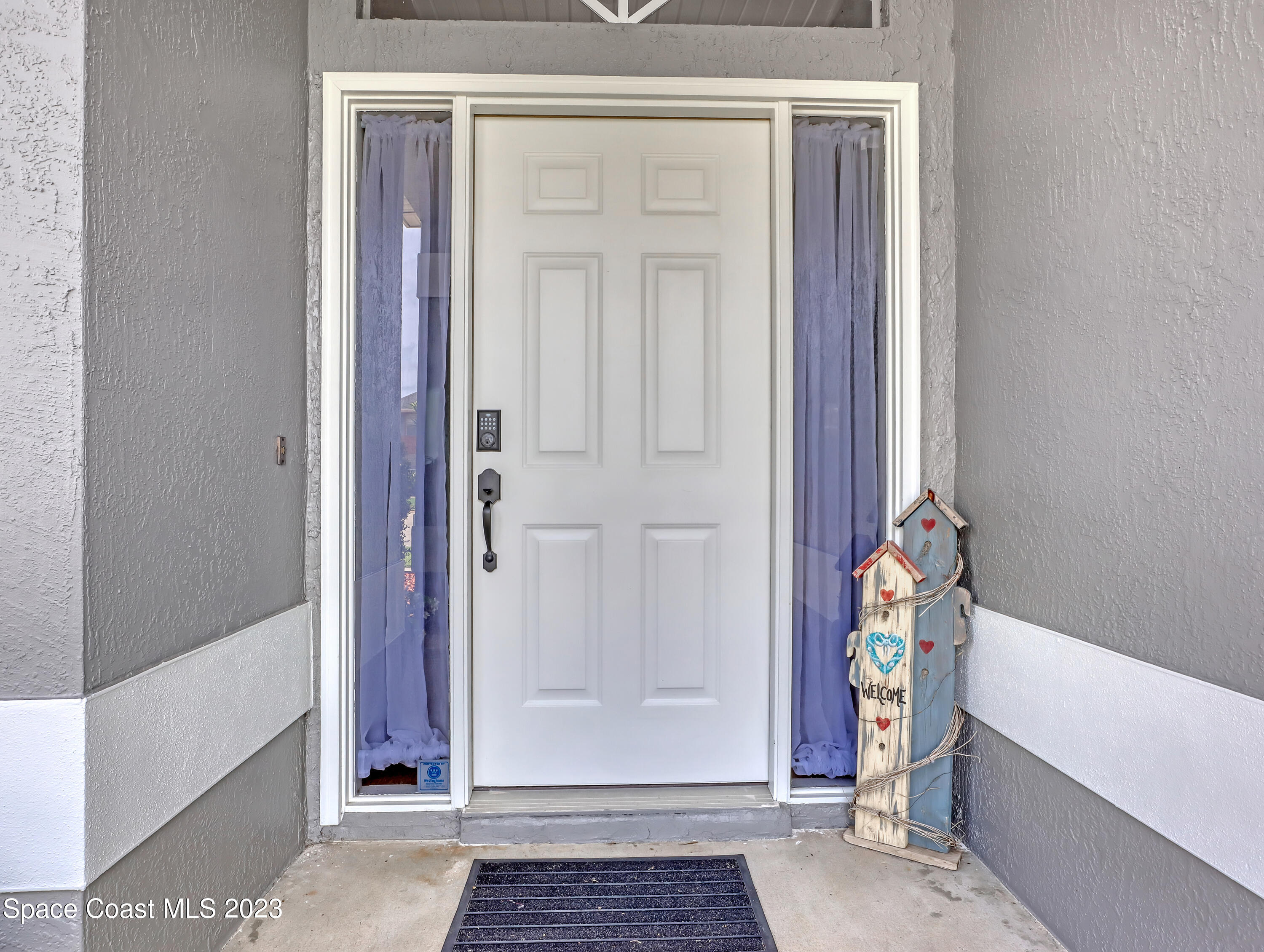 1025 Oak Tree Place Malabar, FL 32950 - Photo 3 of 33 a view of an entryway door