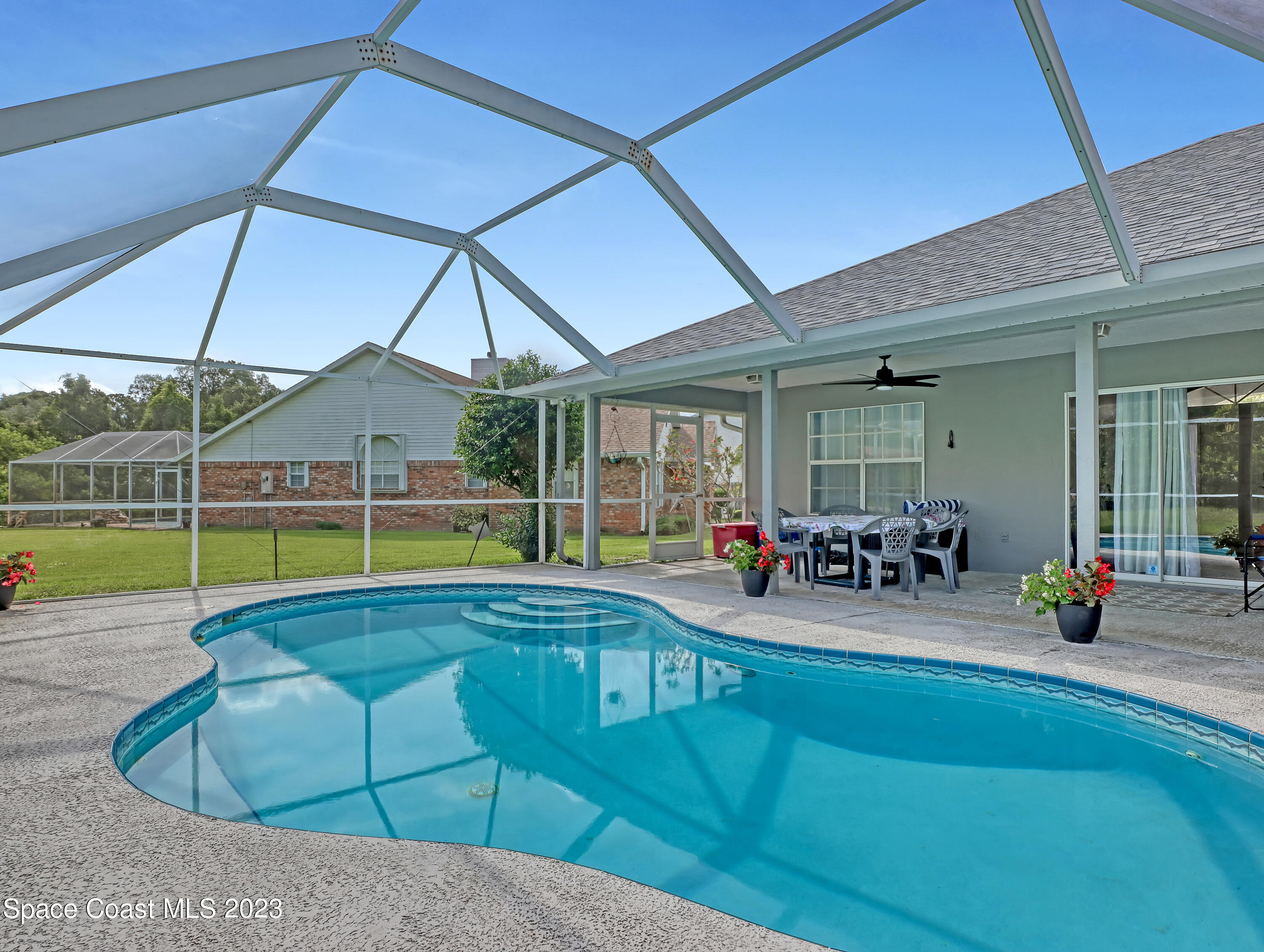 1025 Oak Tree Place Malabar, FL 32950 - Photo 31 of 33 a view of swimming pool with outdoor seating