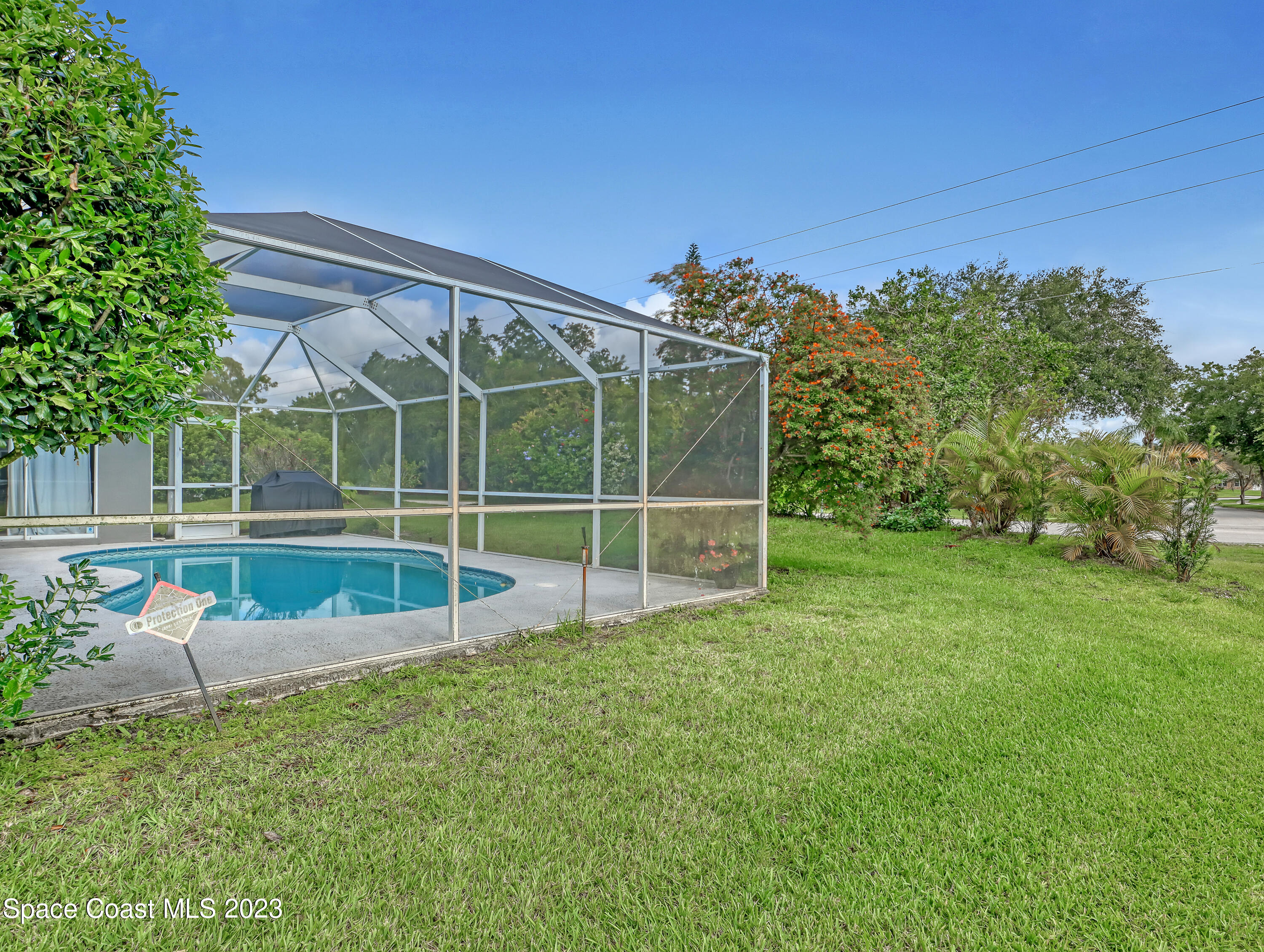 1025 Oak Tree Place Malabar, FL 32950 - Photo 32 of 33 a view of a house with a big yard
