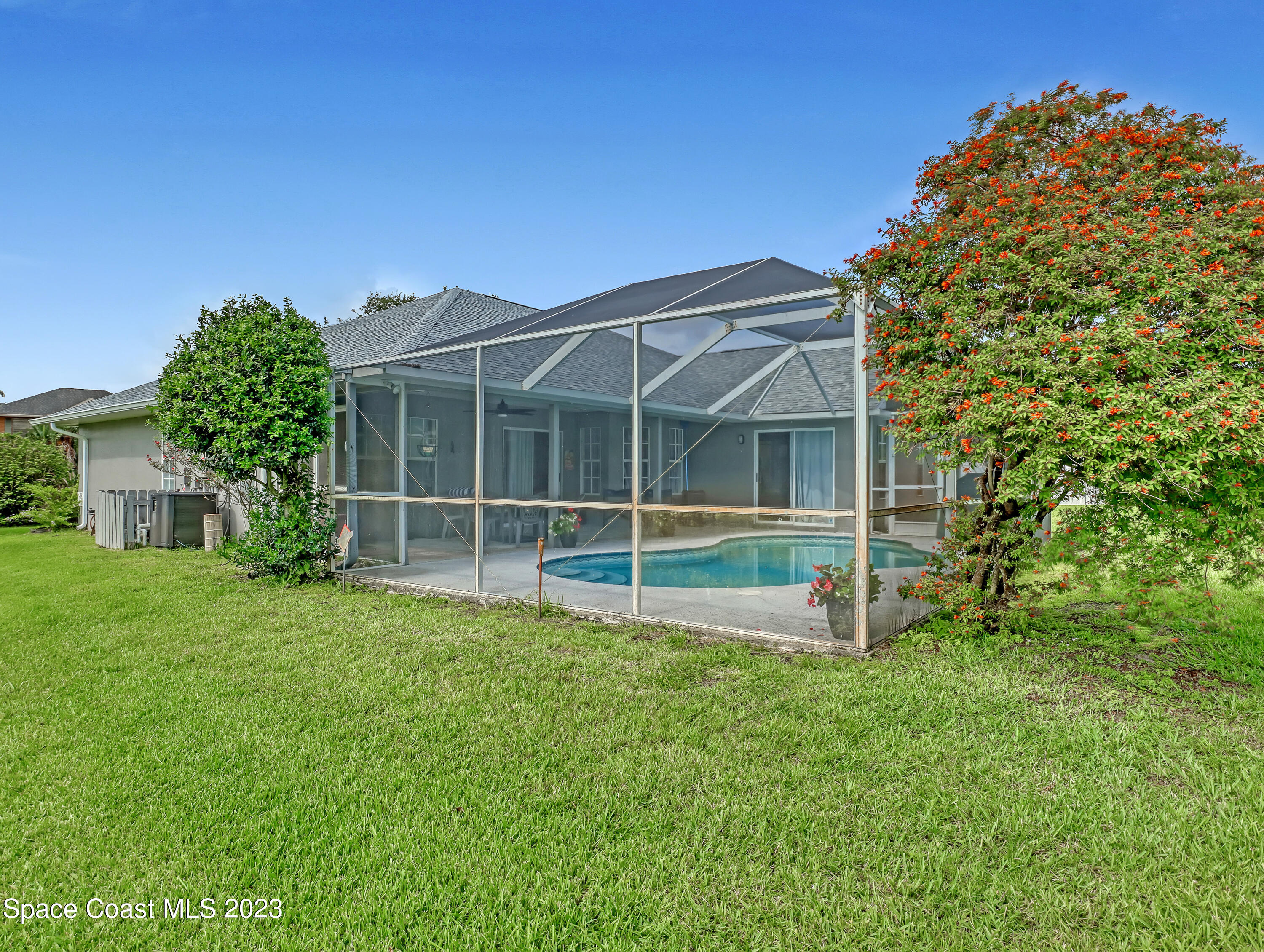 1025 Oak Tree Place Malabar, FL 32950 - Photo 33 of 33 a view of an house with backyard space and garden view