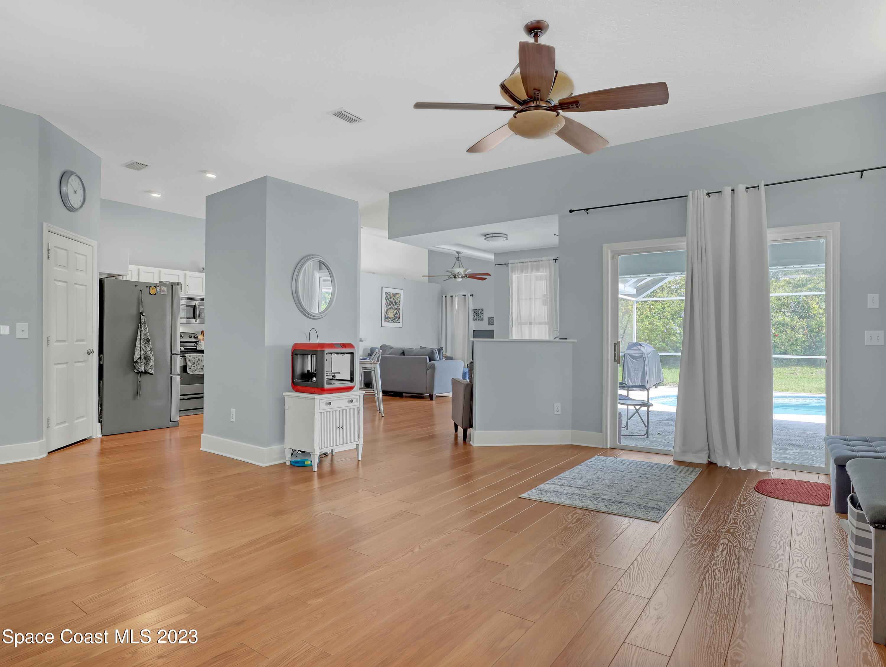 1025 Oak Tree Place Malabar, FL 32950 - Photo 5 of 33 a view of an empty room with window and wooden floor