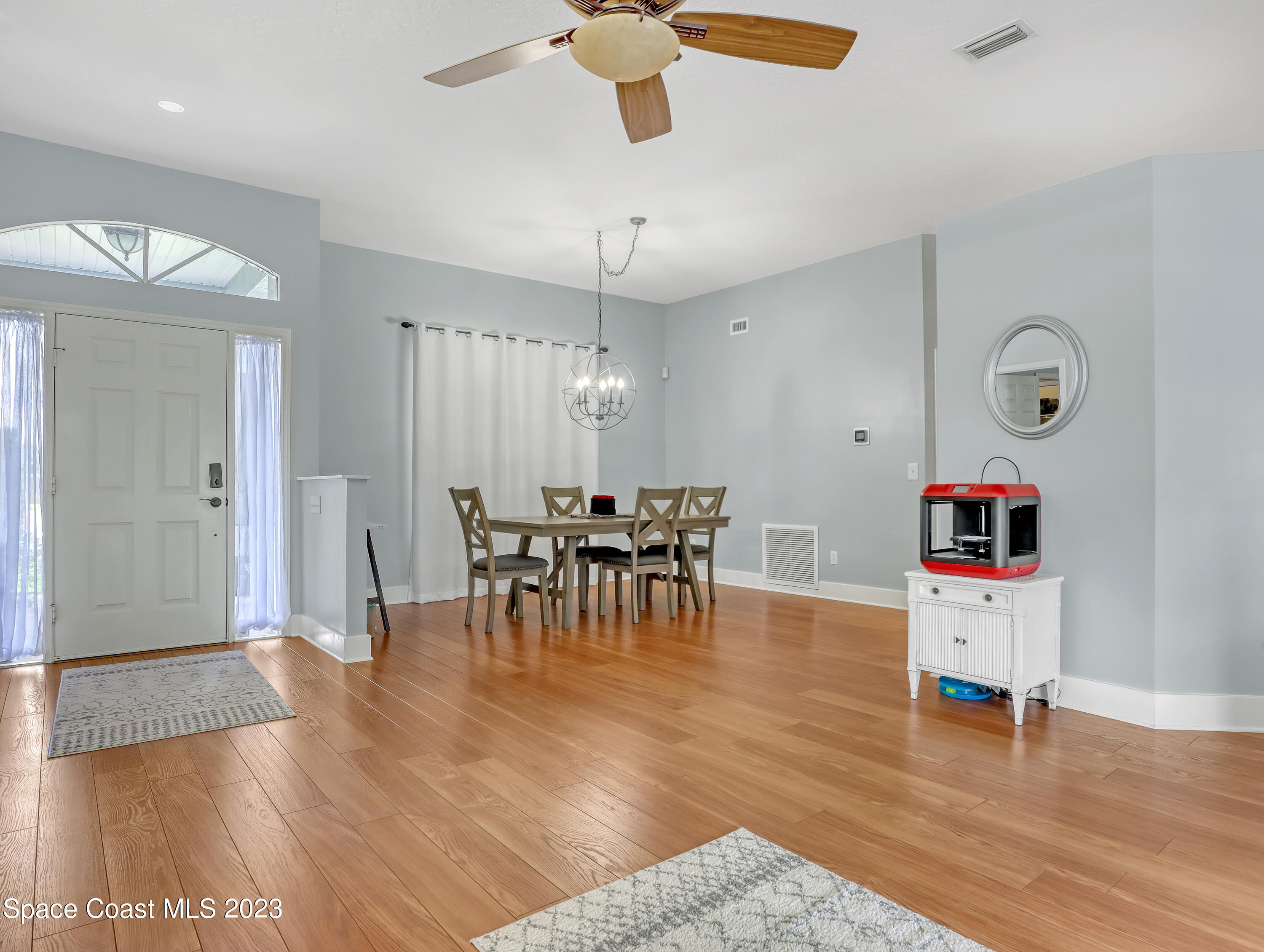 1025 Oak Tree Place Malabar, FL 32950 - Photo 6 of 33 a living room with furniture and wooden floor