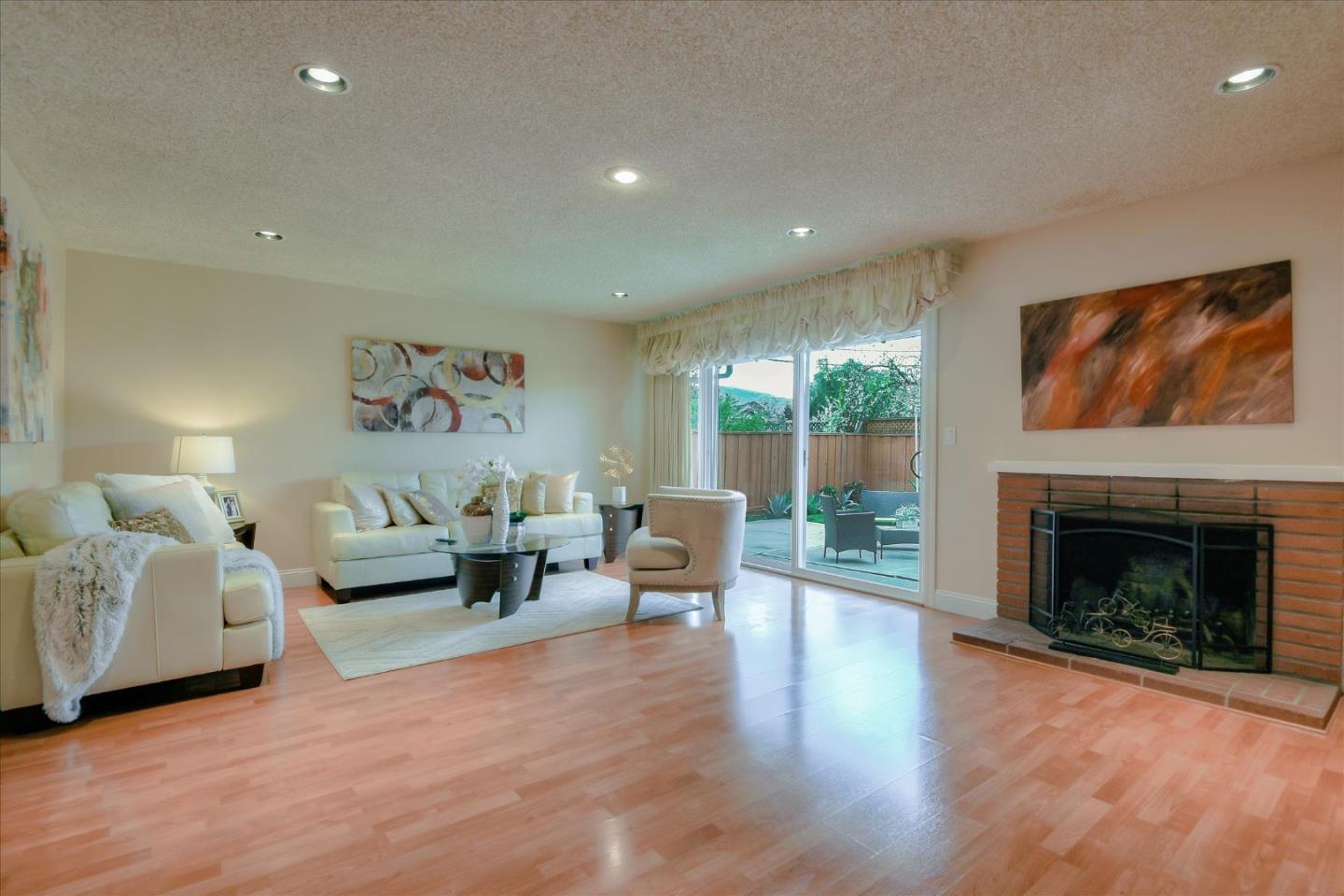 3696 Norfolk Road Fremont, CA 94538 - Photo 4 of 34 a living room with furniture and a fireplace