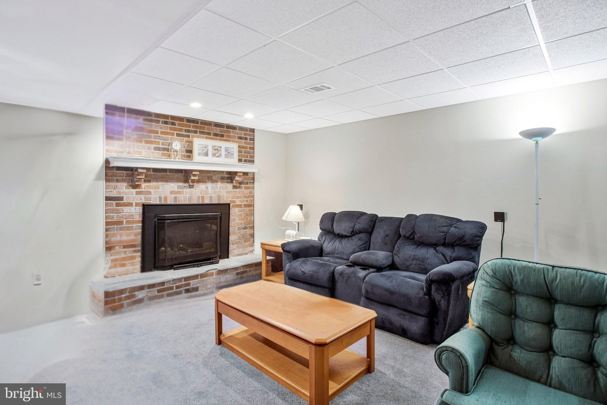 392 S Shore Prince Frederick, MD 20678 - Photo 20 of 30 Cozy retreat with a charming fireplace.