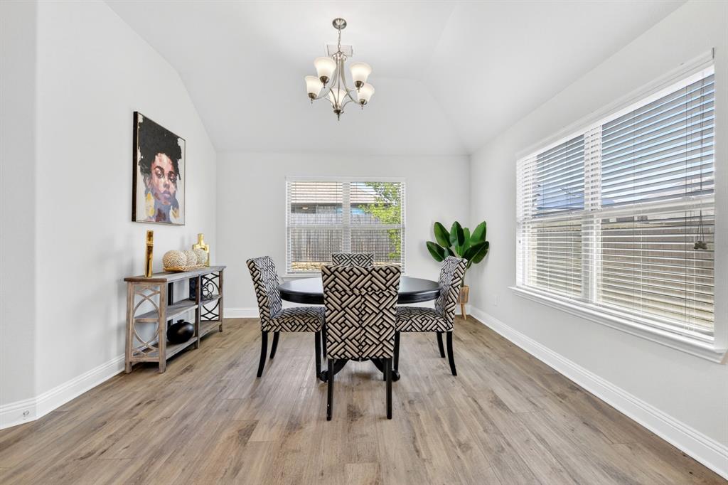 136 Gleeson Drive Red Oak, TX 75154 - Photo 15 of 40 a view of a dining room with furniture window and wooden floor