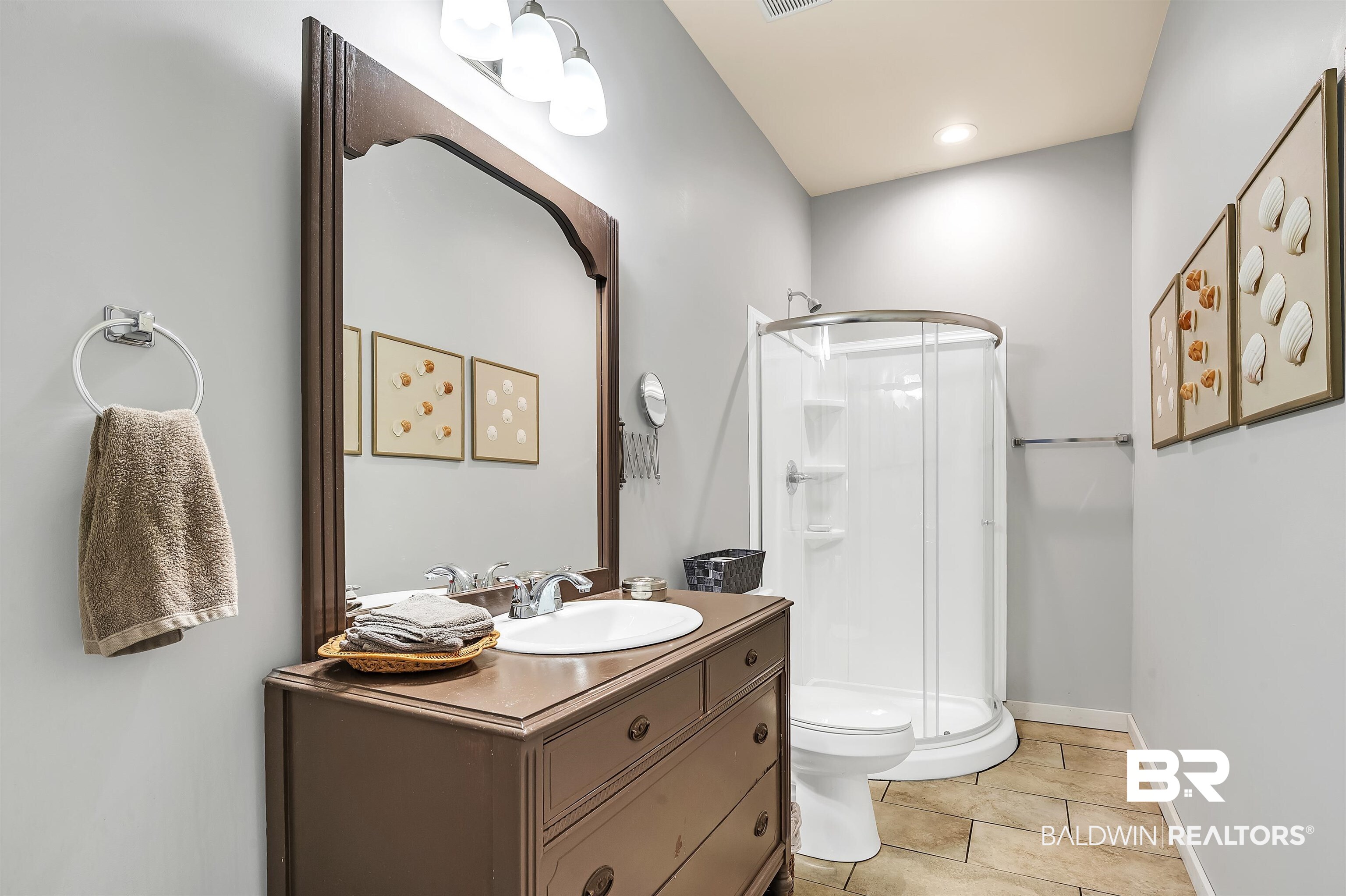 13827 County Road 83 Elberta, AL 36530 - Photo 30 of 38 Full bath featuring a shower stall, vanity, toilet, tile patterned flooring, and baseboards