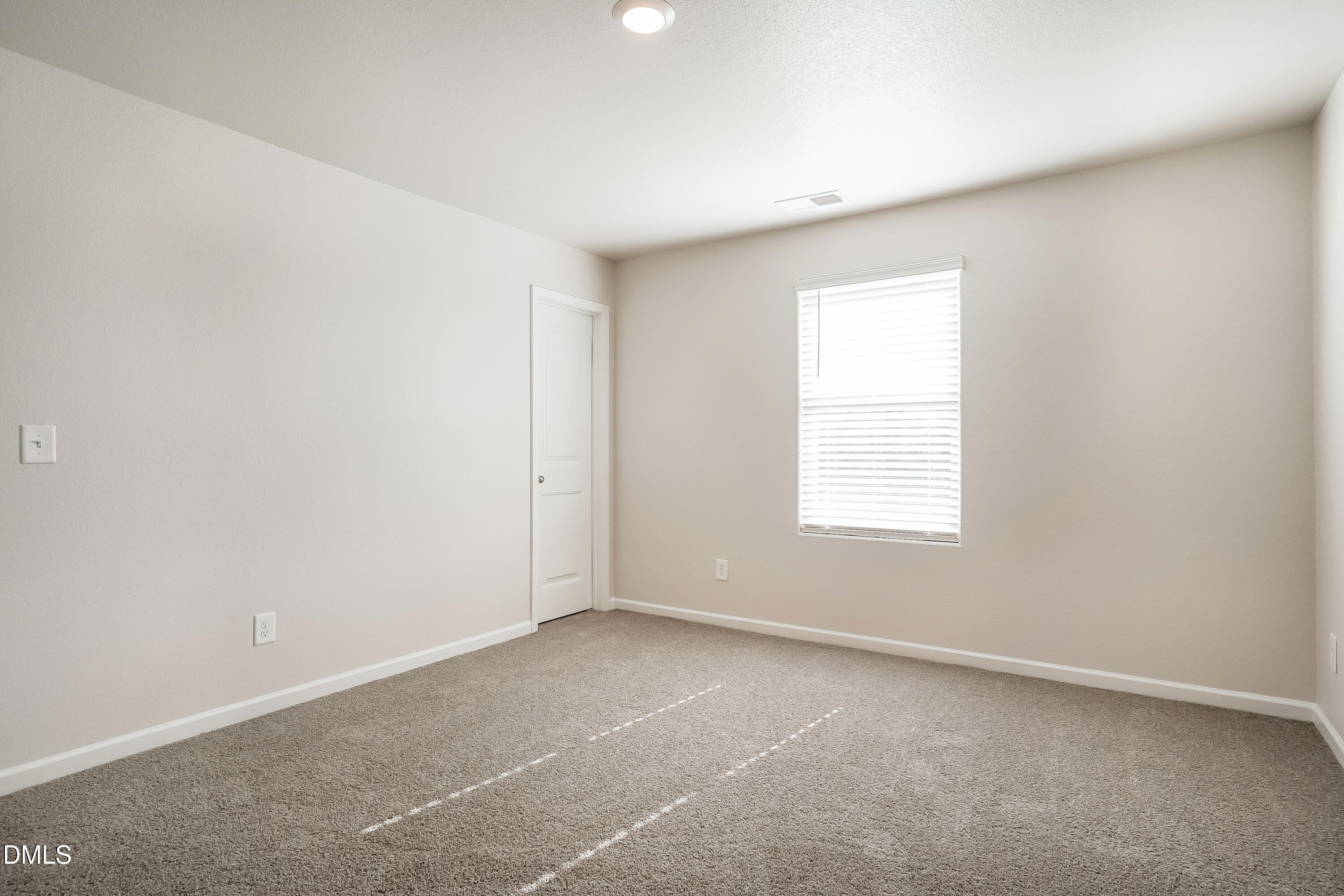 124 Lahinch Drive Fuquay-Varina, NC 27526 - Photo 13 of 17 an empty room with a window