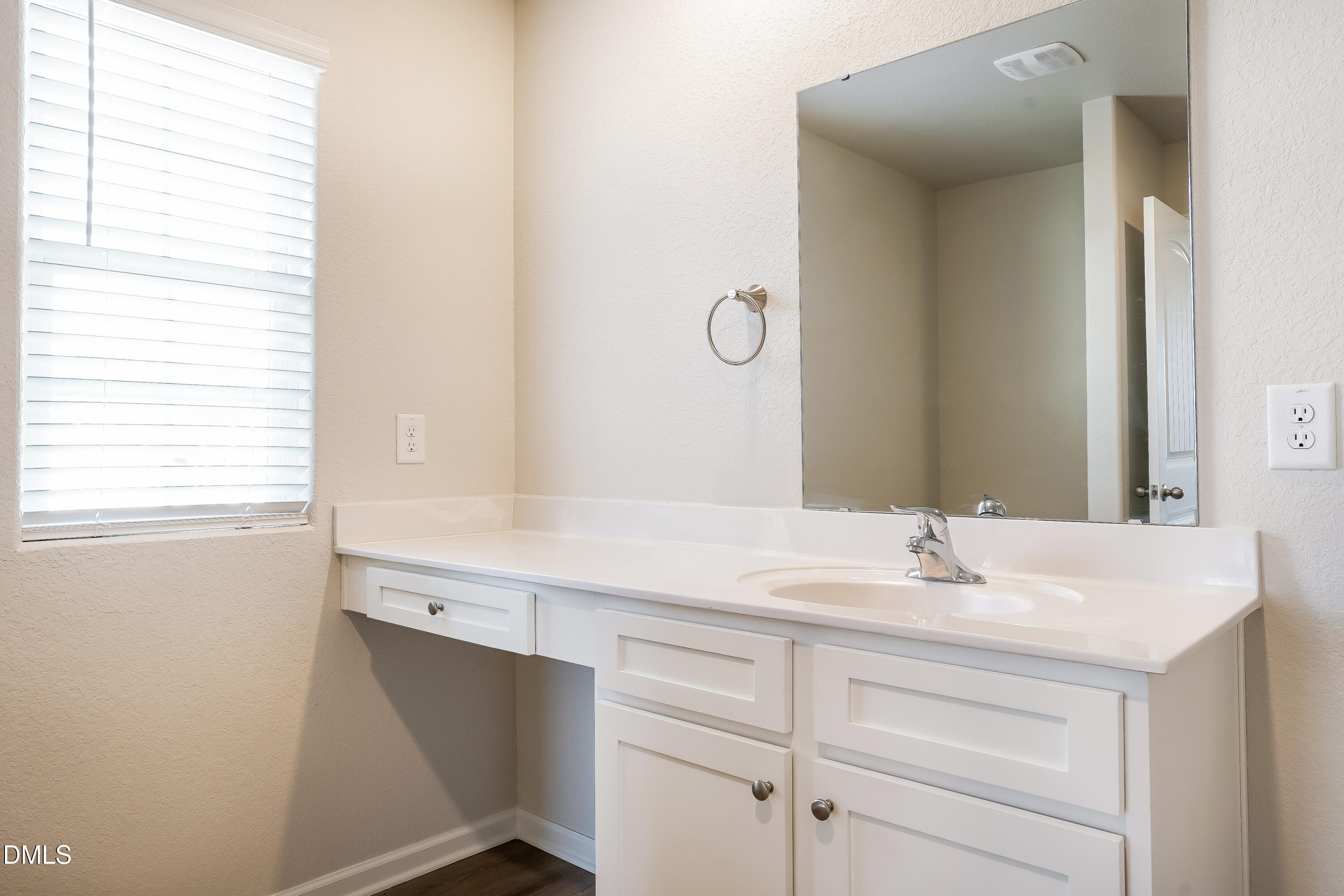 124 Lahinch Drive Fuquay-Varina, NC 27526 - Photo 14 of 17 a bathroom with a sink and a mirror