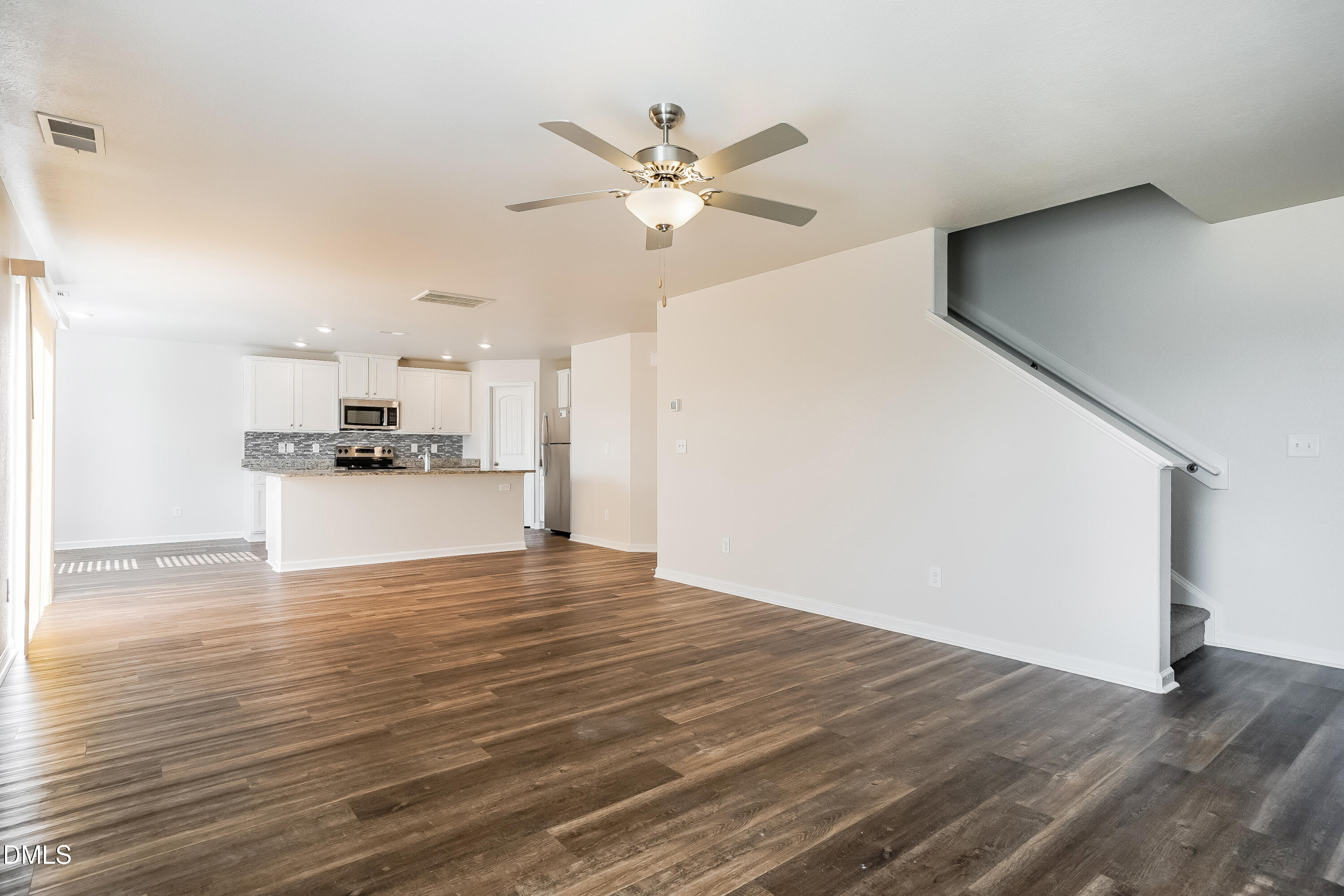 124 Lahinch Drive Fuquay-Varina, NC 27526 - Photo 2 of 17 a view of a kitchen with a sink and a refrigerator