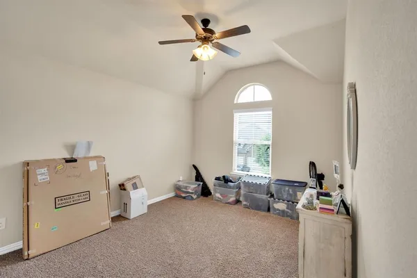 a living room with furniture and white walls