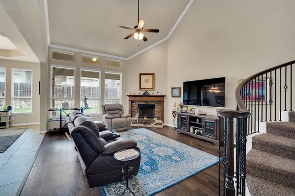 a living room with furniture fireplace and a flat screen tv