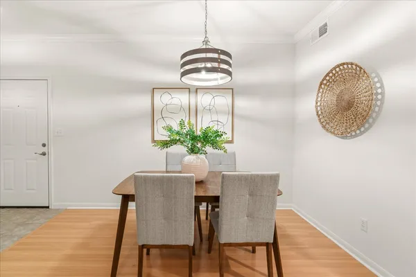 a dining room with furniture and window