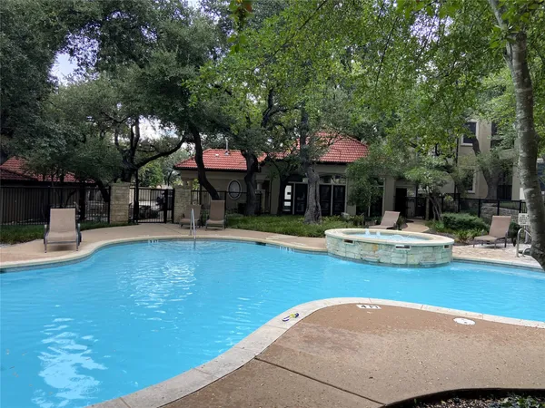 a view of a swimming pool with a sitting space