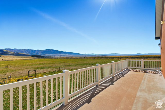 4768 East Hickman Canyon Road Stockton, UT 84071 - Photo 36 of 85 East side second floor balcony featuring a mountain view and a view of rural area.