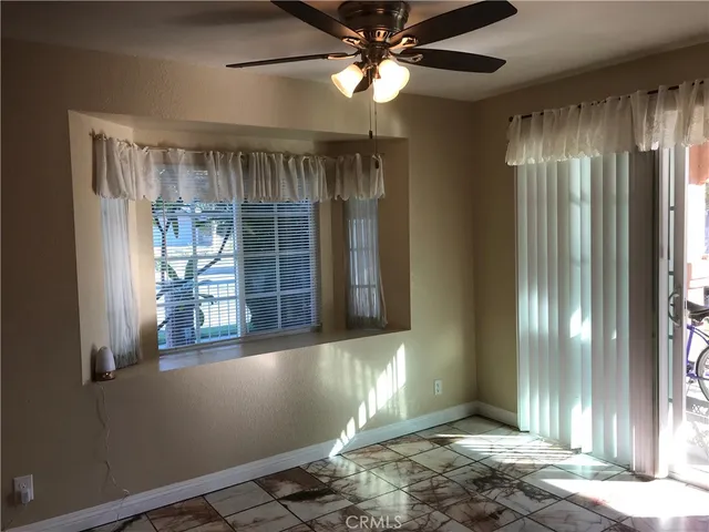 a view of a refrigerator in kitchen and wooden floor
