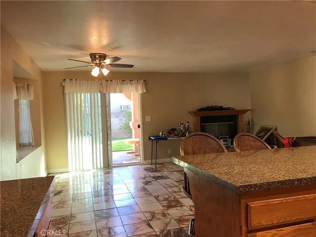 a living room with furniture a dining table and chairs