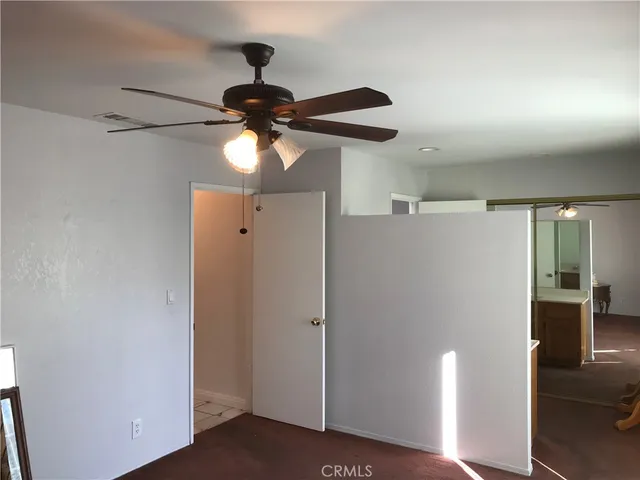 a bathroom with a sink a toilet and vanity