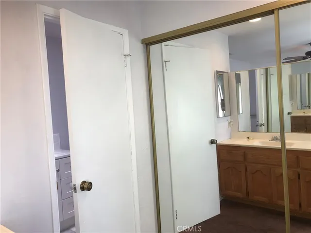 a view of a patio with table and chairs