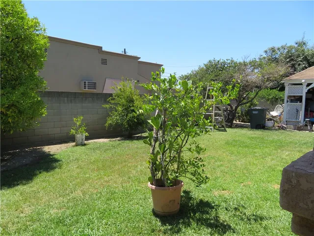 a view of storage and utility room with two washing machine