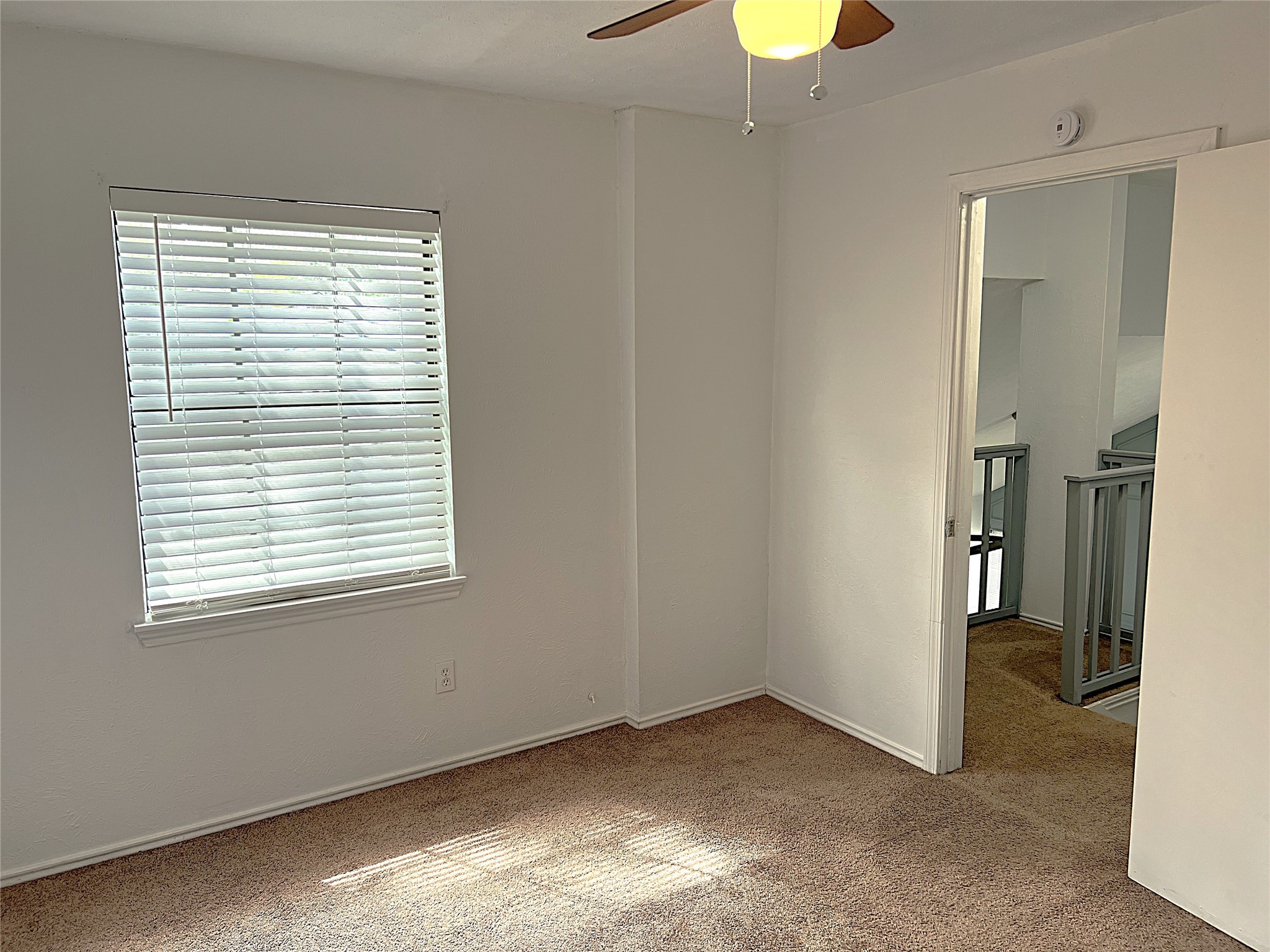 19906 Rising Star Drive Humble, TX 77338 - Photo 18 of 32 an empty room with a window and a bathroom