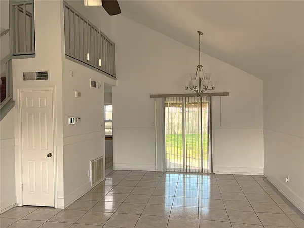 a view of an entryway with a chandelier