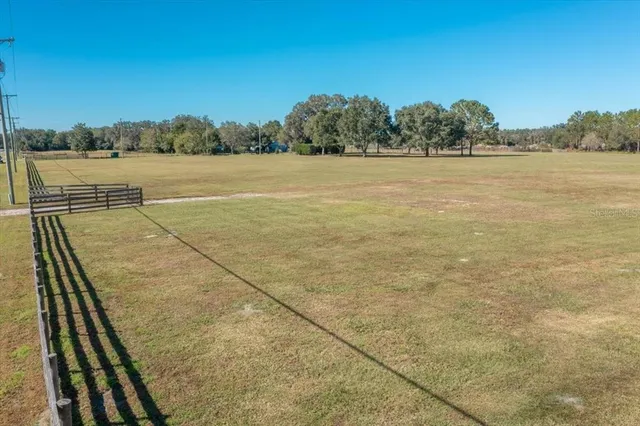 a view of an outdoor space and tennis court