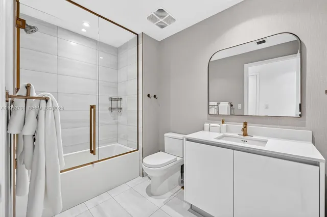 a bathroom with a toilet and a sink