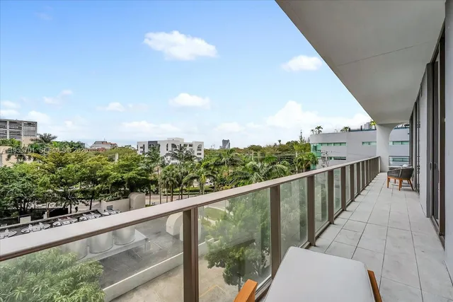 a view of a balcony with an outdoor space